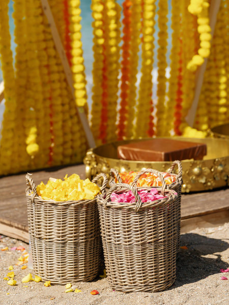 Yellow Haldi ceremony decor installation on beach