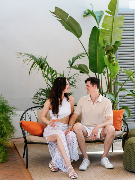 Newlyweds relaxing on terrace during Tuscany wedding weekend