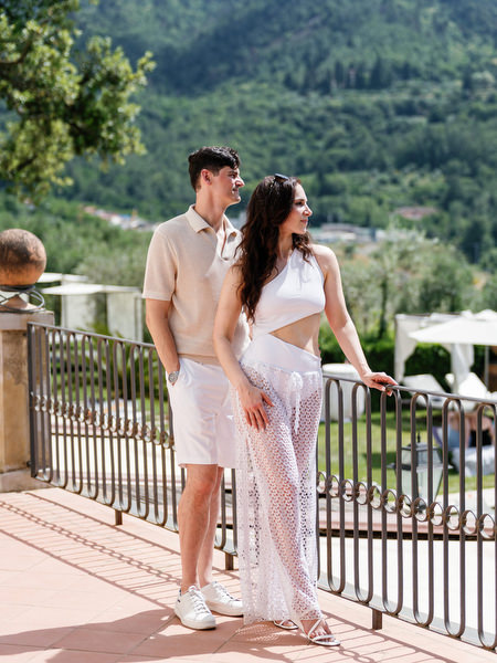 Newlyweds relaxing on terrace during Tuscany wedding weekend