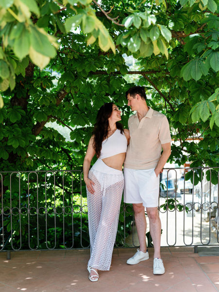 Bride and groom walking through Tuscan garden
