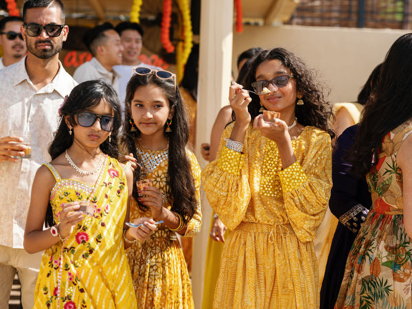 Guests cheering during Haldi ceremony celebration