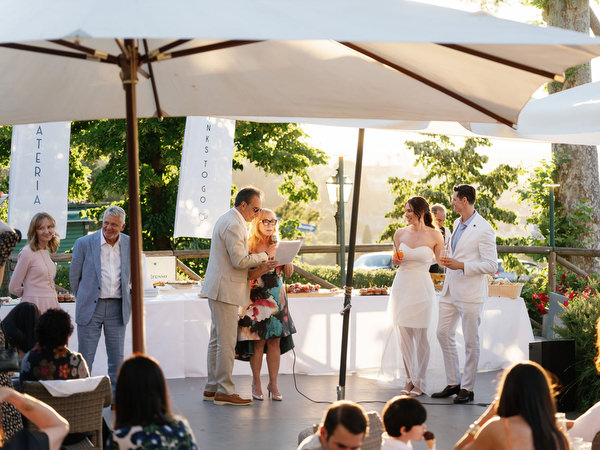Parents giving toast during Florence destination wedding celebration