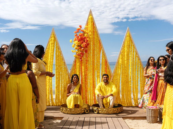 Guests cheering during Haldi ceremony celebration