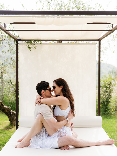 Romantic couple sitting together in Tuscany villa garden