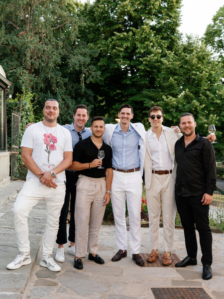 Guests posing for group photo during Florence pre-wedding party