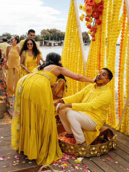 Groom laughing during Haldi ceremony ritual