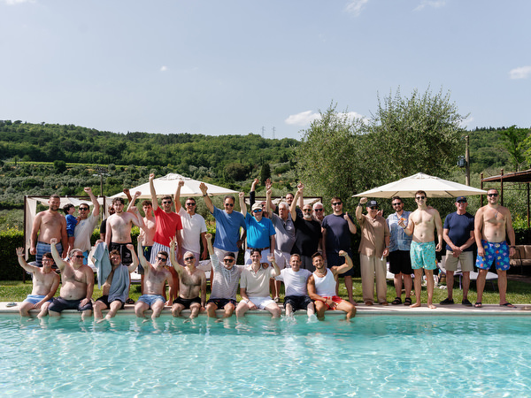 Guests celebrating by the pool during wedding weekend