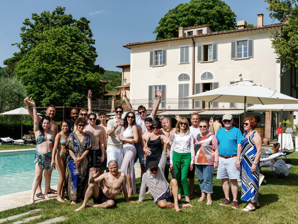 Guests celebrating by the pool during wedding weekend