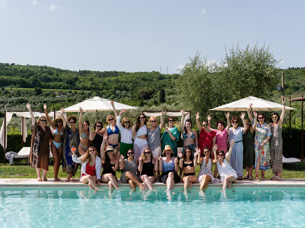 Guests celebrating by the pool during wedding weekend