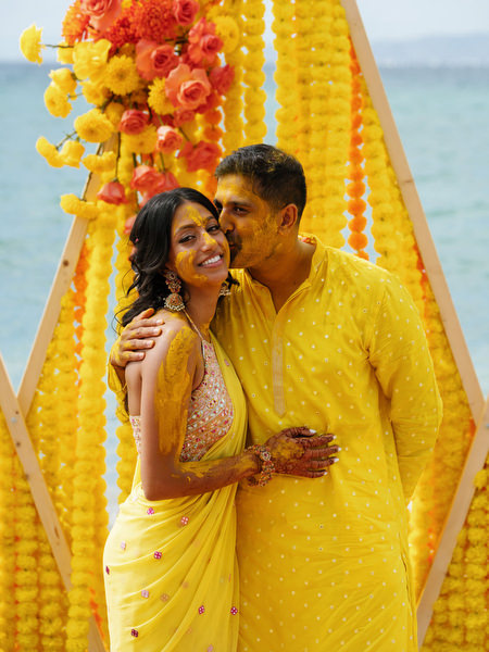 Couple embracing after Haldi ceremony ritual