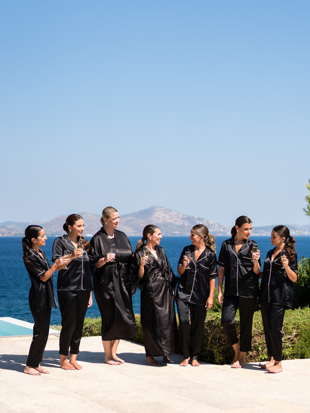 Bridesmaids in black pajamas at Athens Riviera wedding.