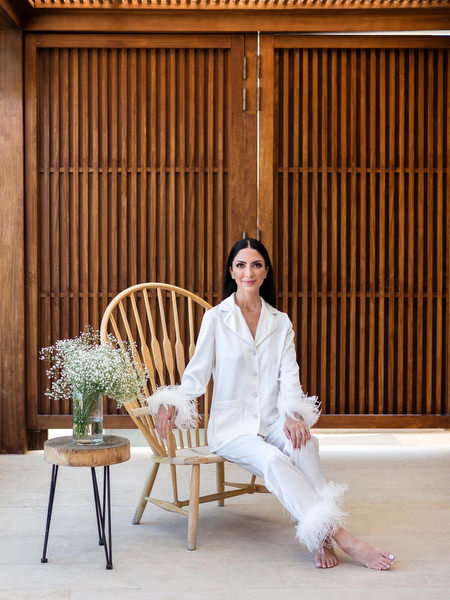 Bride in white bridal pajamas at Island Resort Athens Riviera.