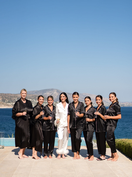 Bridesmaids in black silk pajamas at Athens Riviera wedding.