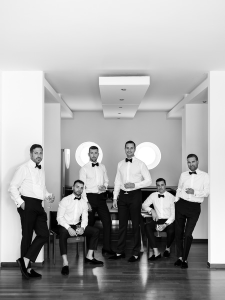 Groomsmen portrait in black tuxedos at Athens wedding.