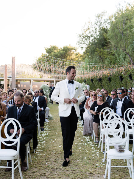 Groom ceremony entrance at Athens Riviera wedding.