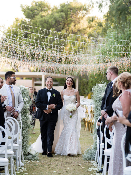 Bride walking down aisle atIsland Resort Athens Riviera.