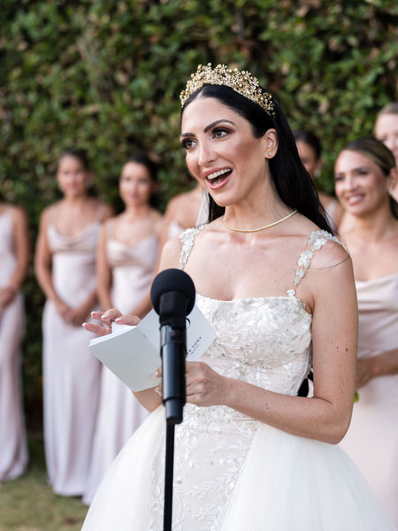 Bride reading vows at Athens Riviera wedding.