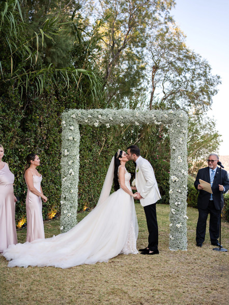 Wedding ceremony kiss at Private House Island Resort Athens Riviera Athens.