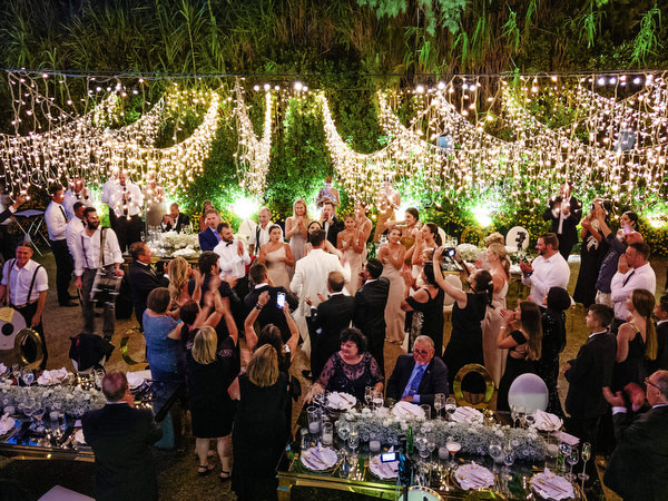 Outdoor Athens Riviera wedding reception at night.