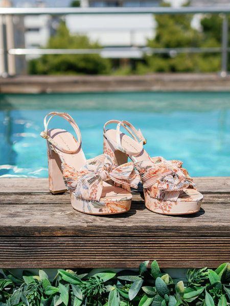 Loeffler Randall floral heels photographed by the pool at Island Resort, luxury Athens Riviera wedding venue in Greece.
