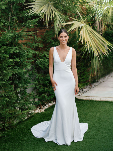 Bride in sleek white gown at Island Resort, luxury destination wedding in Athens on the Athenian Riviera.