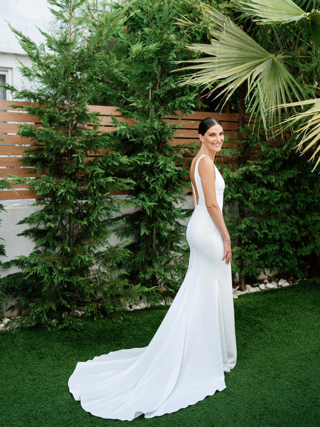 Full-length bridal portrait with flowing train at Island Resort, elegant Athens wedding on the Athenian Riviera.