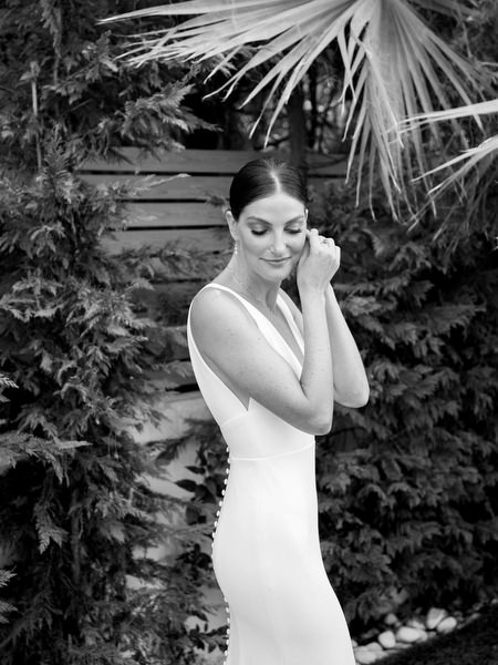 Bride in sleek white gown at Island Resort, luxury destination wedding in Athens on the Athenian Riviera.