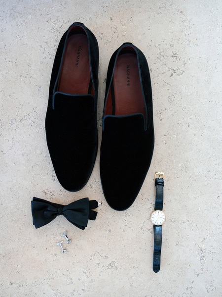 Groom accessories including black velvet shoes and bow tie photographed at Island Resort, luxury Athens Riviera wedding venue in Greece.