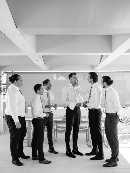 Groom and groomsmen getting ready at Island Resort before an elegant Athens Riviera wedding ceremony.