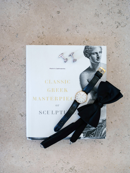 Groom details styled with bow tie and watch at Island Resort, black-tie Athens wedding on the Athenian Riviera.