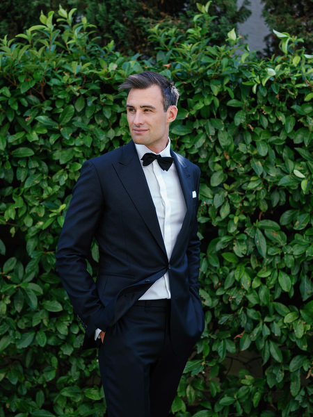 Groom portrait in tuxedo at Island Resort, luxury Athens wedding venue on the Athenian Riviera.