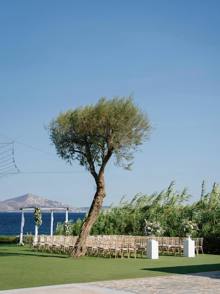 Seaside wedding ceremony lawn at Island Resort overlooking the Aegean Sea, Athens Riviera wedding venue in Greece.