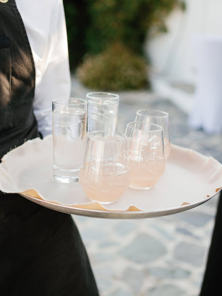 Welcome drinks served before ceremony at Island Resort, luxury Athens wedding on the Athenian Riviera.