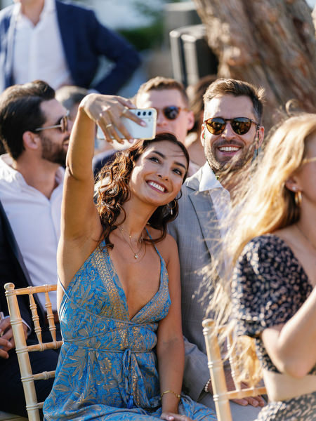 Wedding guests enjoying the ceremony setup at Island Resort, luxury Athens destination wedding in Greece.