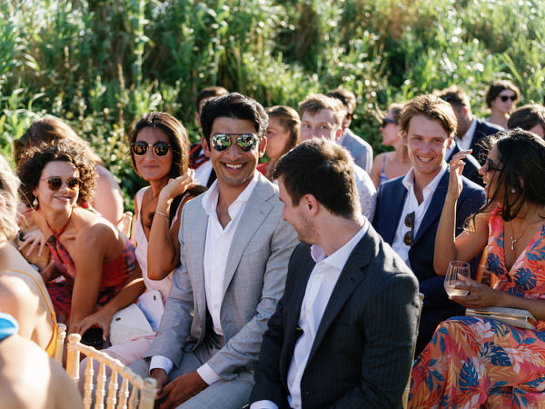 Guests enjoying the atmosphere before the ceremony at Island Resort, luxury Athens wedding venue.
