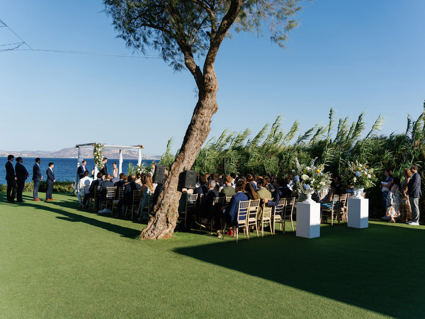 Guests seated during ocean-view ceremony at Island Resort, luxury wedding in Athens, Greece.