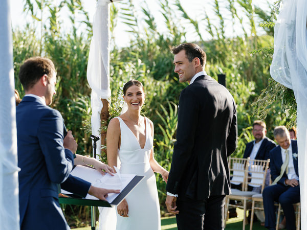 Wedding ceremony at Island Resort overlooking the Aegean Sea, elegant Athens Riviera destination wedding.