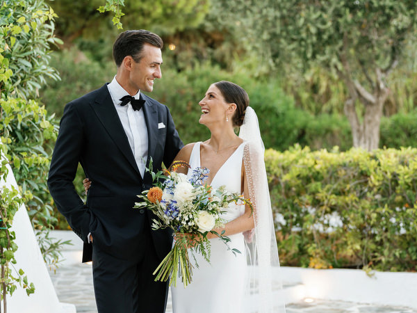 Bride and groom laughing together at Island Resort, luxury Athens Riviera destination wedding.