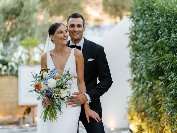 Newlyweds at Island Resort during sunset, luxury Athens destination wedding in Greece.