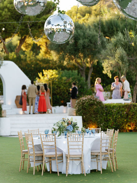 Round reception table setup at Island Resort, luxury Athens Riviera wedding celebration.