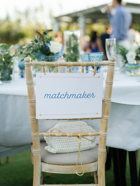 Personalized wedding reception chair detail at Island Resort, chic Athens Riviera wedding decor.