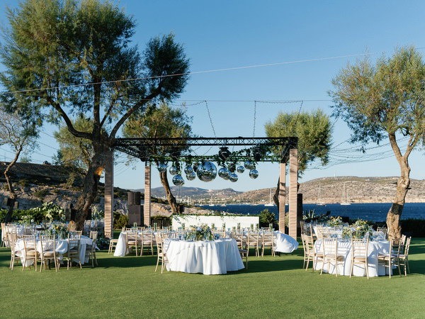 Outdoor wedding reception setup at Island Resort, luxury Athens Riviera destination wedding.