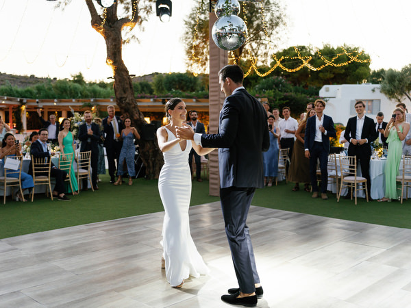 Bride and groom dancing at Island Resort, romantic Athens Riviera wedding reception by the sea.