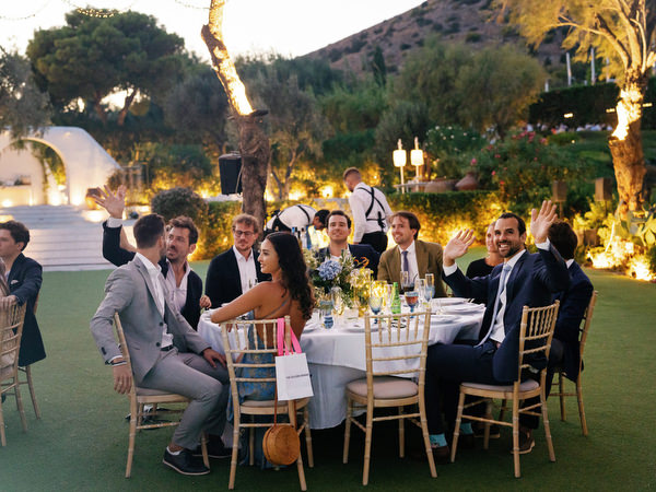 Guests enjoying evening reception at Island Resort, luxury Athens Riviera wedding celebration.
