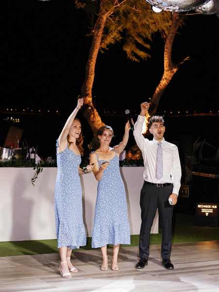 Bridesmaids celebrating on dance floor at Island Resort, vibrant Athens Riviera wedding reception.