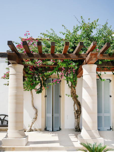 Bougainvillea-covered pergola at Anassa Hotel luxury wedding venue in Cyprus.