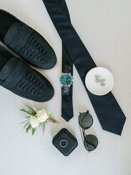 Groom accessories including tie, shoes and boutonniere at Anassa Hotel Cyprus wedding.