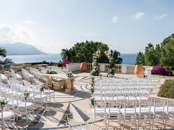 Elegant outdoor ceremony seating overlooking the sea at Anassa Hotel Cyprus.