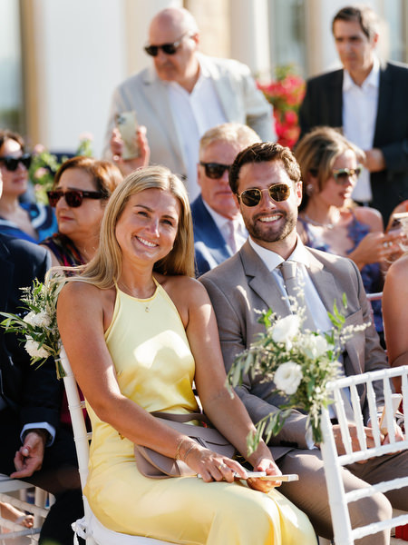 Guests smiling during luxury Cyprus wedding ceremony at Anassa Hotel.