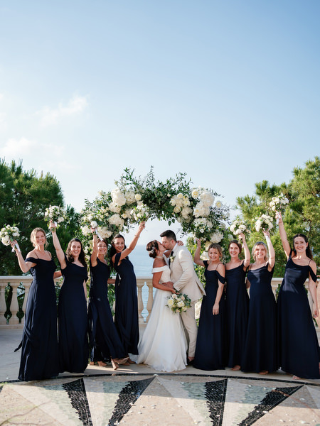 Bridal party celebrating with bride at Anassa Hotel wedding in Cyprus.